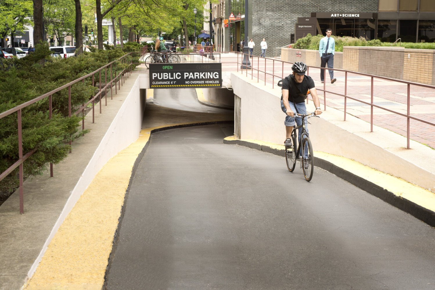 Cyclist riding up the garage ramp onto the Orrington Plaza pedestrian plaza