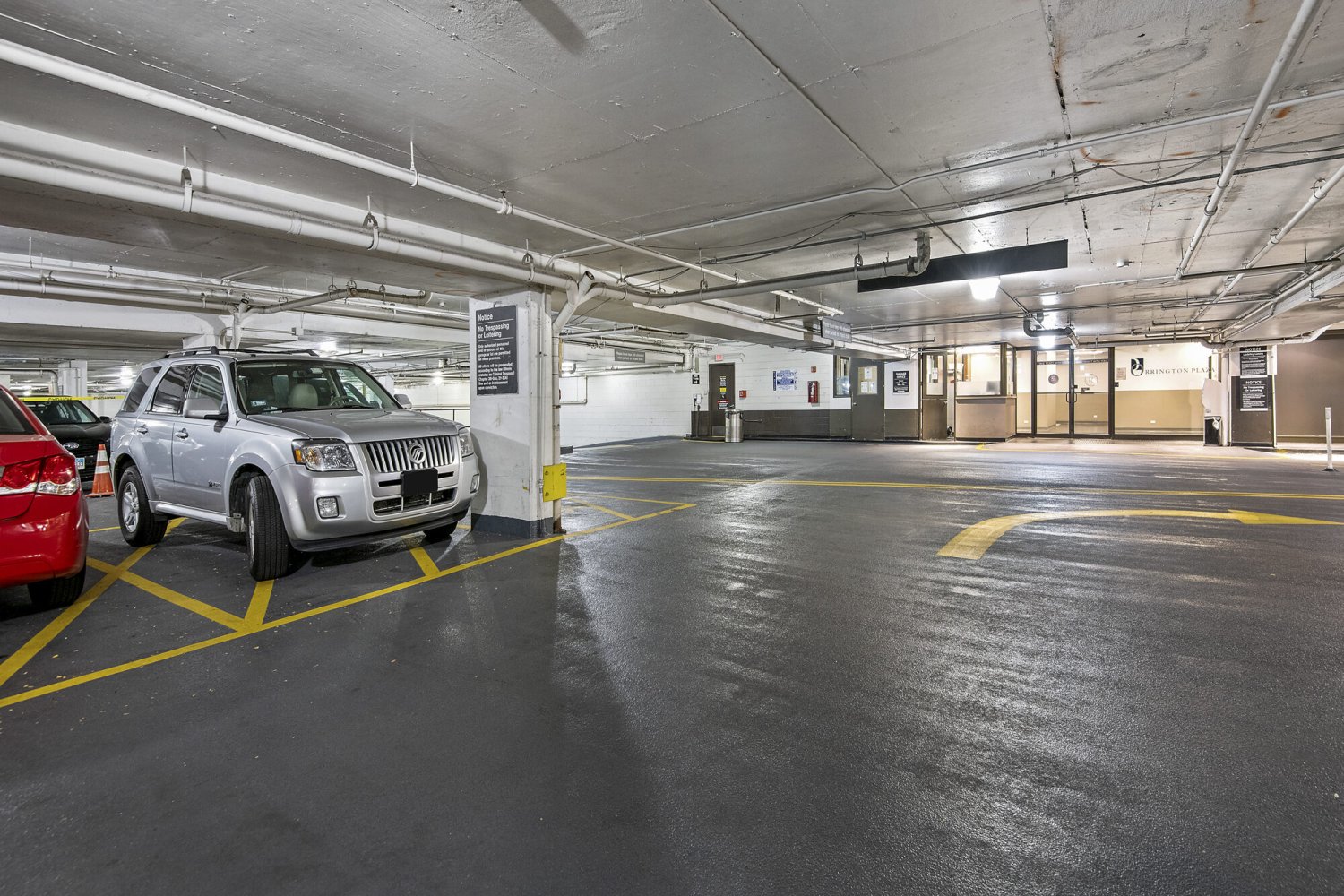 Brightly lit below-grade parking garage with direct access to the Orrington Plaza elevator lobby